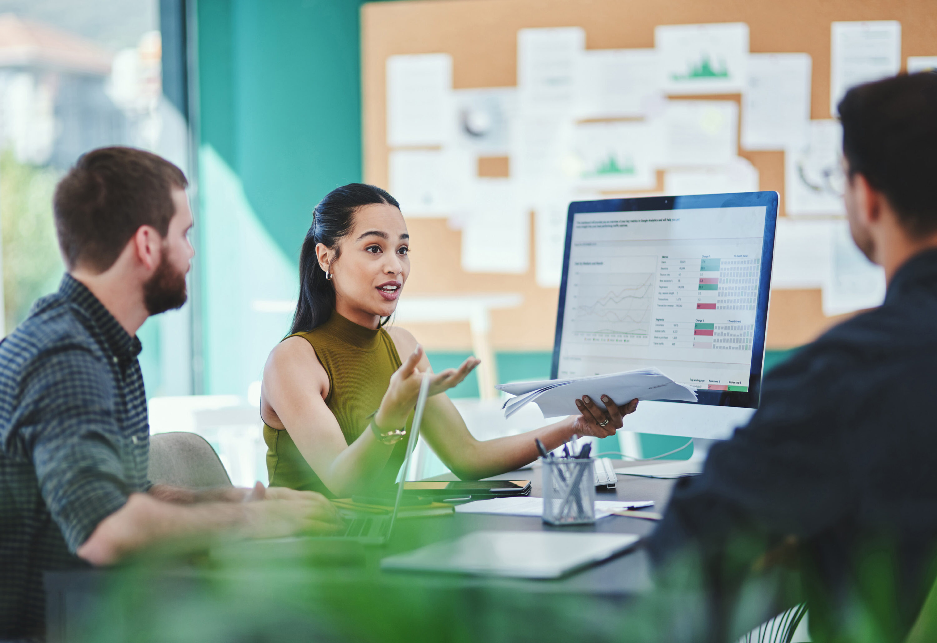 Team reviewing hiring performance data together in a collaborative meeting setting
